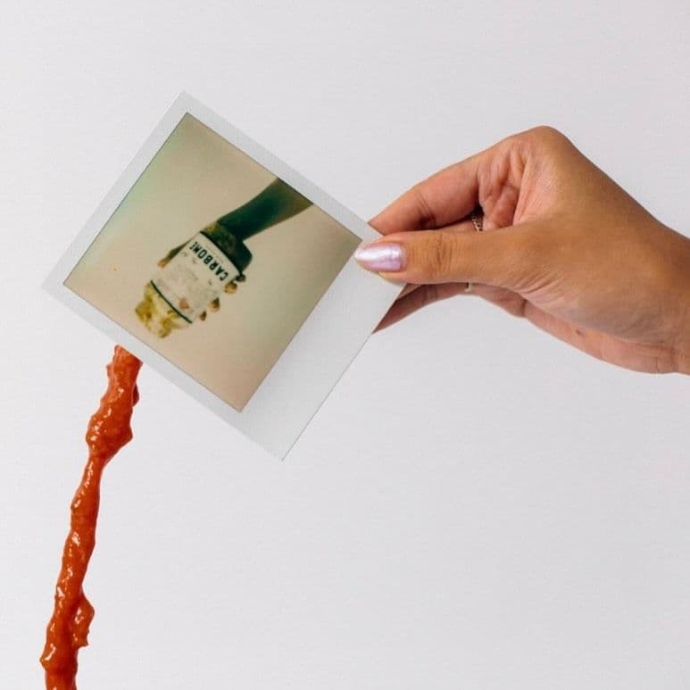 Sauce spilling from polaroid