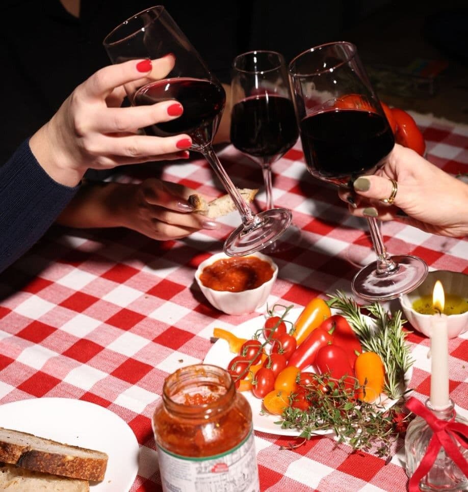 People toastin over a crowded table